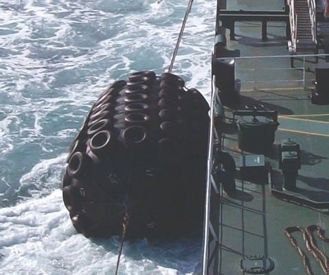Pneumatic Yokohama fenders rigged to vessel