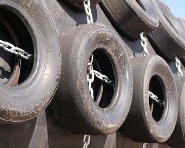 Close up of Yokohama pneumatic fender with tyre net protection
