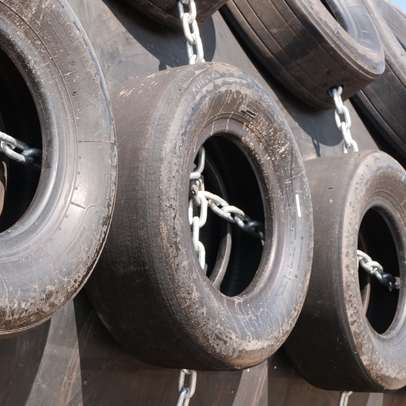Close up of Yokohama pneumatic fender with tyre net protection