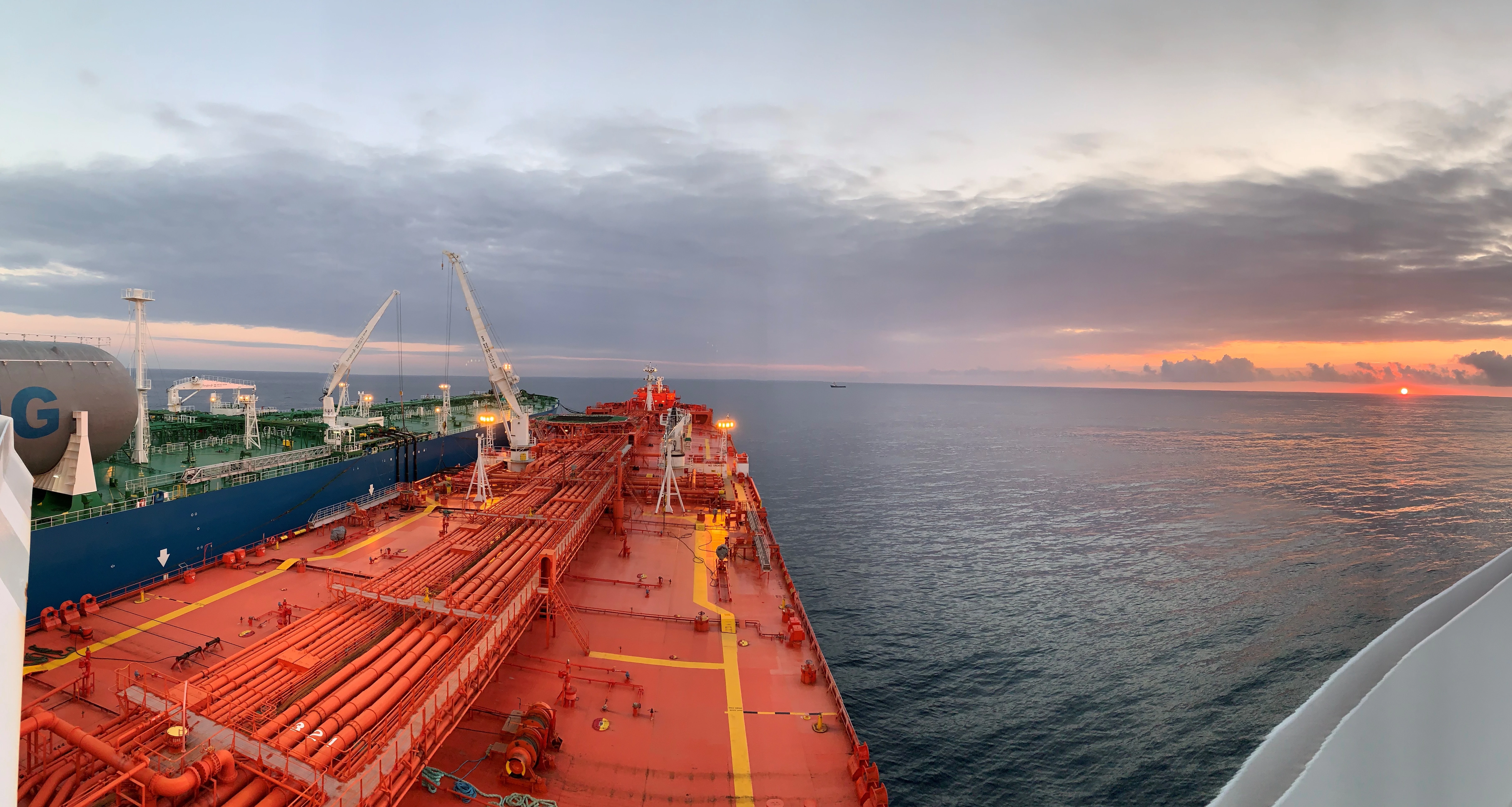 LNG STS transfer with sunset