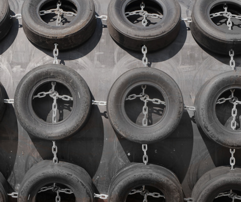Close up of Yokohama pneumatic fender with tyre net protection